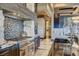 Close-up of a well-equipped kitchen featuring a professional-grade range and custom backsplash at 677 Boulder Summit Dr, Henderson, NV 89012