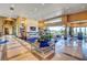 Spacious living room featuring tile floors, large windows, a fireplace, and stylish decor at 677 Boulder Summit Dr, Henderson, NV 89012