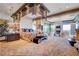 Luxurious main bedroom with a mirrored accent wall, fireplace and seating area at 677 Boulder Summit Dr, Henderson, NV 89012