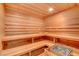 Inviting sauna with wooden benches and a heater for a relaxing spa experience at 677 Boulder Summit Dr, Henderson, NV 89012