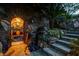 A stone entryway leads to a wine cellar featuring barrels and decorative lighting, adding rustic charm to the home at 677 Boulder Summit Dr, Henderson, NV 89012