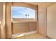 Spacious balcony with palm tree views, concrete flooring and stucco wall and ceiling at 7701 Himalayas Ave # 104, Las Vegas, NV 89128