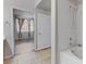 Bright bathroom featuring white tiled shower and bath with updated fixtures and tile flooring at 7701 Himalayas Ave # 104, Las Vegas, NV 89128