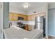 Kitchen with white tile counters and wood cabinets at 7701 Himalayas Ave # 104, Las Vegas, NV 89128