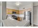 Kitchen features stainless steel appliances, white countertops, and ample cabinet space at 7701 Himalayas Ave # 104, Las Vegas, NV 89128