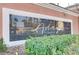 Close-up of community signage featuring the 'Adagio' name with manicured landscaping and an elegant exterior design at 7701 Himalayas Ave # 104, Las Vegas, NV 89128