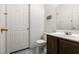 Cozy bathroom with tiled floor, vanity, and ample lighting at 7936 Dexter Falls St, Las Vegas, NV 89149