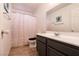 This bathroom features a sink, mirror, toilet and combination tub and shower at 7936 Dexter Falls St, Las Vegas, NV 89149