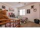 A shared bedroom with two twin beds and a decorative shelf at 7936 Dexter Falls St, Las Vegas, NV 89149