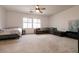 Expansive bedroom with plush carpet, a ceiling fan, and lots of space at 7936 Dexter Falls St, Las Vegas, NV 89149