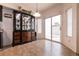 Bright dining area featuring a glass display cabinet and sliding glass door to the backyard at 7936 Dexter Falls St, Las Vegas, NV 89149