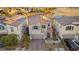 Aerial view of house with solar panels and driveway at 23 Papavero Ct, Henderson, NV 89011