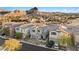 Aerial view of a house community with mountain backdrop at 23 Papavero Ct, Henderson, NV 89011