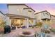 Backyard with patio, fire pit, and landscaping at 23 Papavero Ct, Henderson, NV 89011