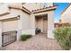 Front entry with paved walkway and seating area at 23 Papavero Ct, Henderson, NV 89011