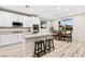 Modern kitchen with white cabinets and island at 23 Papavero Ct, Henderson, NV 89011