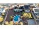 Expansive backyard featuring a pool, slide, gazebo, basketball court, and solar panels on house roof at 260 E Desert Rose Dr, Henderson, NV 89015