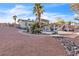 A backyard featuring a pool, gazebo, and thoughtful desert-style landscaping with rocks at 260 E Desert Rose Dr, Henderson, NV 89015