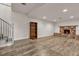 Finished basement area featuring modern flooring, fireplace, and staircase at 260 E Desert Rose Dr, Henderson, NV 89015