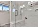 Beautiful bathroom features a glass shower enclosure, and white marble-look tile at 260 E Desert Rose Dr, Henderson, NV 89015