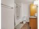 Clean bathroom featuring a shower-tub combo and wooden cabinets at 260 E Desert Rose Dr, Henderson, NV 89015