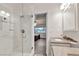 Bathroom with a glass shower enclosure and view into the bedroom at 260 E Desert Rose Dr, Henderson, NV 89015