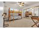 Spacious bedroom with tan carpet, mirrored closet doors, and natural light at 260 E Desert Rose Dr, Henderson, NV 89015