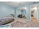 The bedroom features light blue walls, mirrored closet doors, and tiled floors in the hallway at 260 E Desert Rose Dr, Henderson, NV 89015