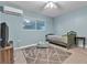 Comfortable bedroom with a gray area rug, soft blue walls, and ceiling fan at 260 E Desert Rose Dr, Henderson, NV 89015