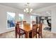 Bright dining room features a large window and an open concept connecting to the kitchen at 260 E Desert Rose Dr, Henderson, NV 89015