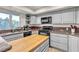 Well-lit kitchen features modern appliances, a butcher block island, and generous counter space at 260 E Desert Rose Dr, Henderson, NV 89015