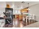 Functional kitchen with wood floors and cabinets, desk area, and breakfast bar at 260 E Desert Rose Dr, Henderson, NV 89015