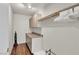 Well-lit laundry room with cabinets, countertops, and a hanging rod for clothing at 260 E Desert Rose Dr, Henderson, NV 89015