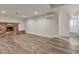 Cozy living room featuring modern flooring and a brick fireplace, creating a warm atmosphere at 260 E Desert Rose Dr, Henderson, NV 89015