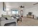 Cozy living room with view of backyard through large bright window at 260 E Desert Rose Dr, Henderson, NV 89015