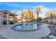 Backyard with an inviting pool, spa, rock features, and a slide for entertainment at 260 E Desert Rose Dr, Henderson, NV 89015