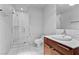 Bathroom with marble tile, a walk-in shower, and modern vanity at 4471 Dean Martin Dr # 801, Las Vegas, NV 89103