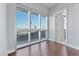 Bedroom with hardwood floors and large windows with city views at 4471 Dean Martin Dr # 801, Las Vegas, NV 89103