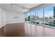 Living room with hardwood floors and floor-to-ceiling windows with city views at 4471 Dean Martin Dr # 801, Las Vegas, NV 89103