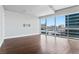 Living room with hardwood floors and floor-to-ceiling windows with city views at 4471 Dean Martin Dr # 801, Las Vegas, NV 89103