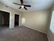 Spacious bedroom with carpet and ceiling fan at 4725 Basilicata Ln # 102, North Las Vegas, NV 89084