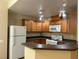 Modern kitchen with wood cabinets and appliances at 4725 Basilicata Ln # 102, North Las Vegas, NV 89084