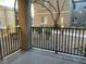 Private patio with metal railing and view at 4725 Basilicata Ln # 102, North Las Vegas, NV 89084