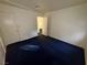 Bedroom with blue carpet and access to another room at 5161 Lindell Rd # 107, Las Vegas, NV 89118