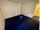 Blue carpeted bedroom with access to bathroom at 5161 Lindell Rd # 107, Las Vegas, NV 89118