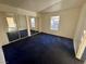 Bright bedroom with blue carpet and mirrored closet doors at 5161 Lindell Rd # 107, Las Vegas, NV 89118