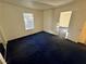 Well-lit bedroom with blue carpet and an exterior view at 5161 Lindell Rd # 107, Las Vegas, NV 89118