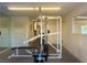 Community gym with weight machines and mirrors at 5161 Lindell Rd # 107, Las Vegas, NV 89118