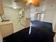 Open kitchen with white cabinets and a breakfast bar at 5161 Lindell Rd # 107, Las Vegas, NV 89118