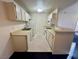 Efficient kitchen, white cabinets, and appliances at 5161 Lindell Rd # 107, Las Vegas, NV 89118